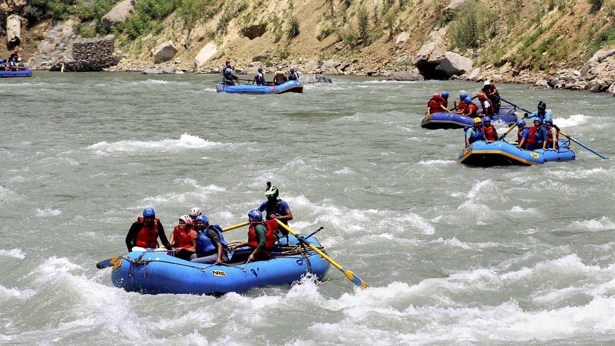 Tourists are seen enjoying a water sport in Manali. Credit: PTI Photo