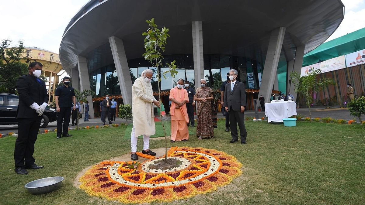 Prime Minister Narendra Modi is seen planting a sapling at the inauguration of the International Cooperation and Convention Centre - Rudraksh, in Varanasi. Credit: PIB Photo