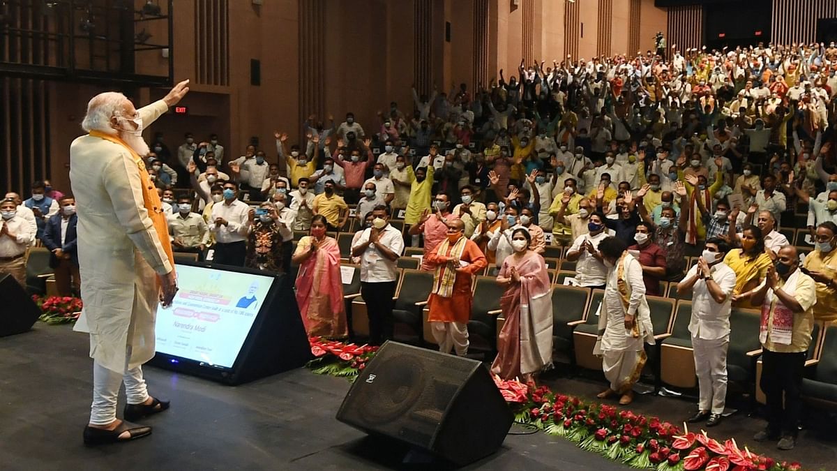 Prime Minister Narendra Modi greets the audience during the inauguration of the International Cooperation and Convention Centre - Rudraksh, in Varanasi, Uttar Pradesh. Credit: PIB Photo