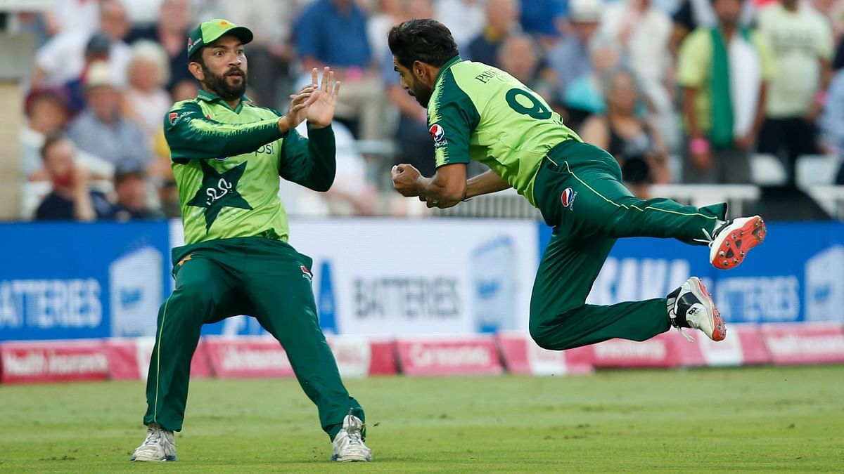Pakistan's Sohaib Maqsood and Haris Rauf in action as England's Moeen Ali is caught out. Credit: Reuters Photo