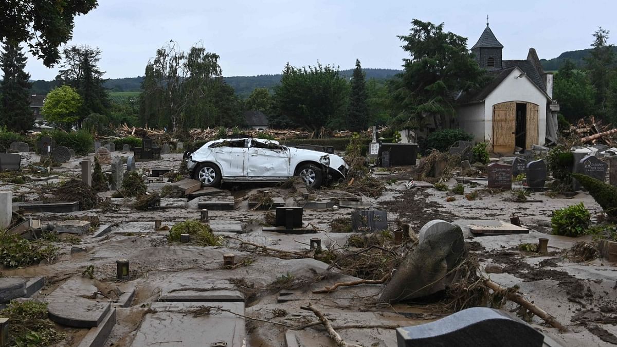 A destroyed car is pictured at the cemetery in Bad Neuenahr-Ahrweiler, western Germany. Credit: AFP Photo