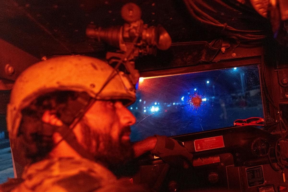 A member of the Afghan Special Forces drives a humvee during a combat mission against Taliban, in Kandahar province, Afghanistan, on July 11, 2021. (Credit: Reuters Photos/Danish Siddiqui)