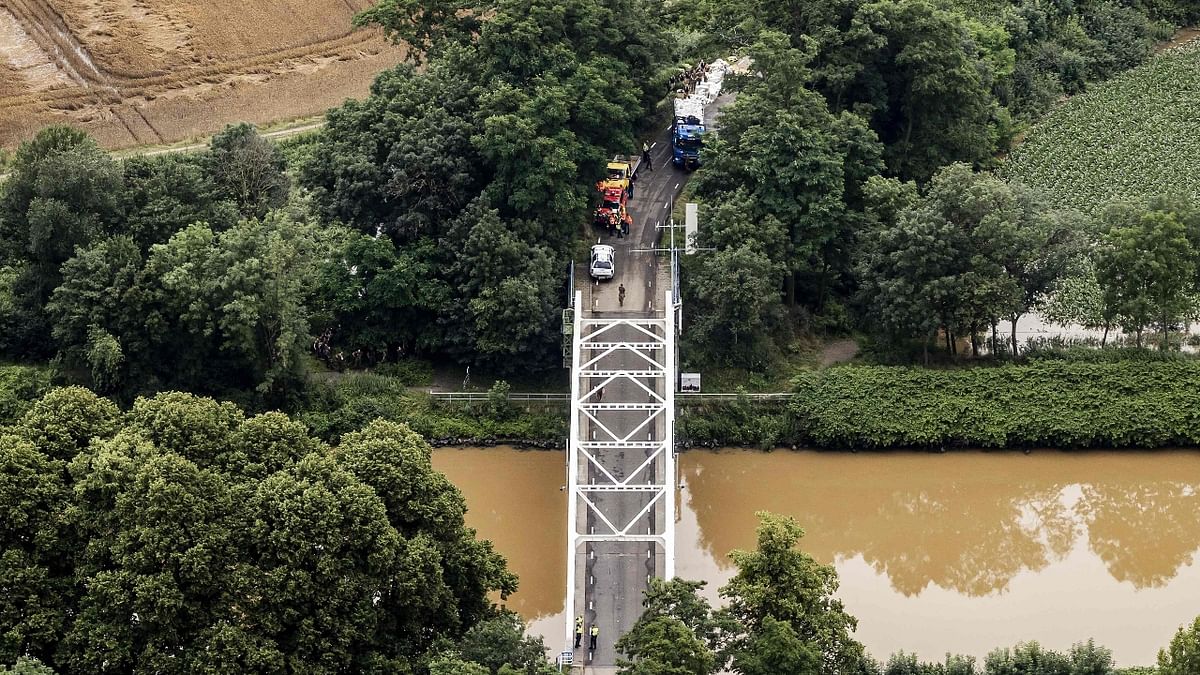 Aerial view taken in Brommelen shows the flooded area around the Meuse after the Juliana Canal broke. Credit: AFP Photo