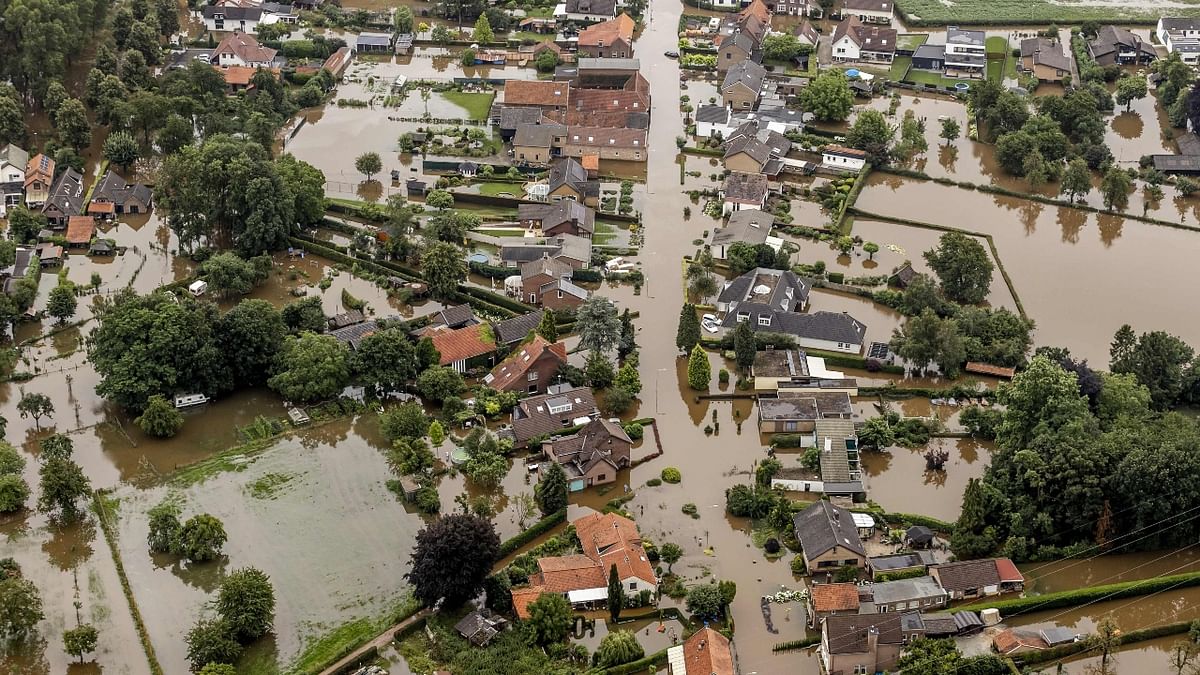 An aerial photo shows areas near Meuse submerged in rain water. The death toll from the devastating floods in Europe soared to at least 126, most in western Germany where emergency responders were frantically searching for missing people. Credit: AFP Photo