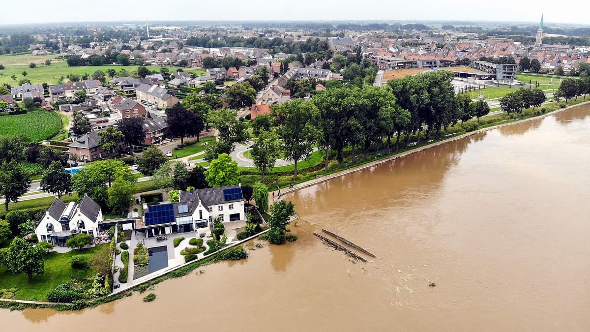 An aerial photo of the Maas/Meuse river in Maaseik, northern Belgium, where the situation remains critical as the water keep rising after the heavy rainfall of the previous days. Credit: AFP Photo
