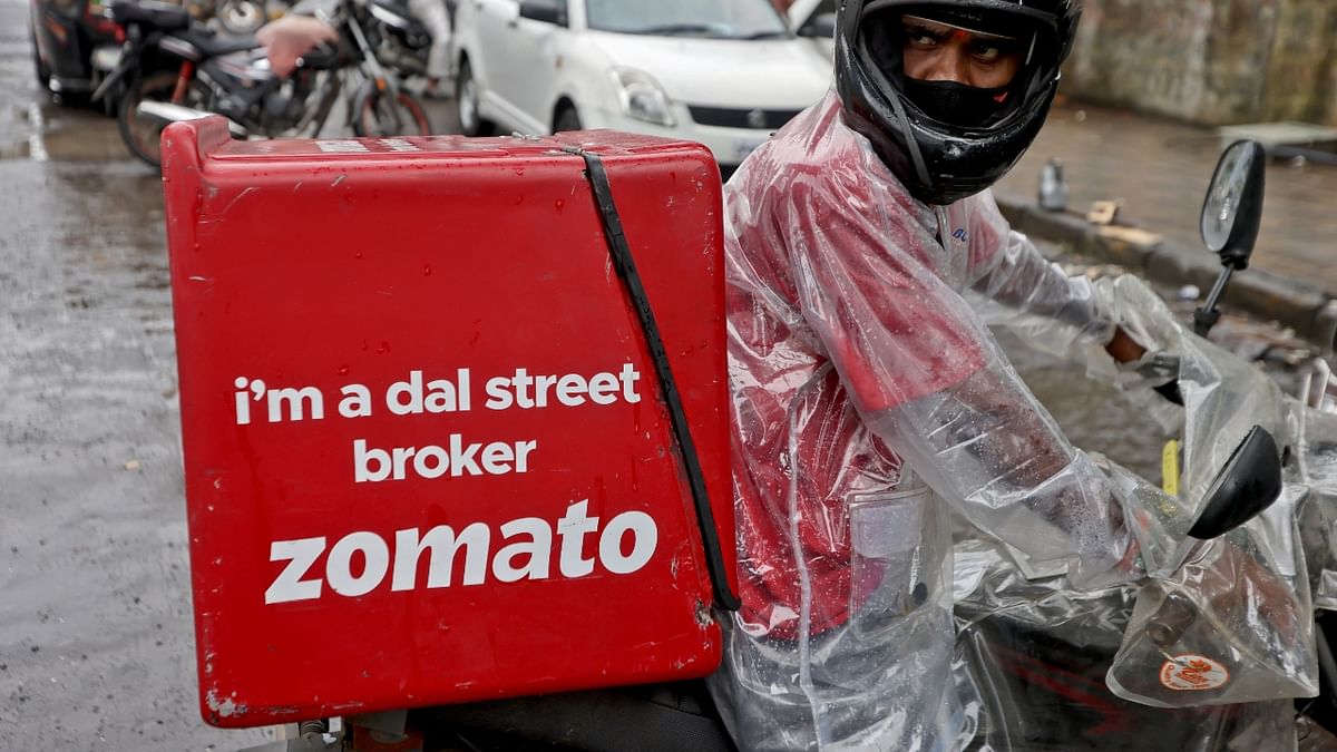 A  Zomato delivery person is seen leaving to pick up an order from a restaurant in Mumbai. Credit: Reuters Photo