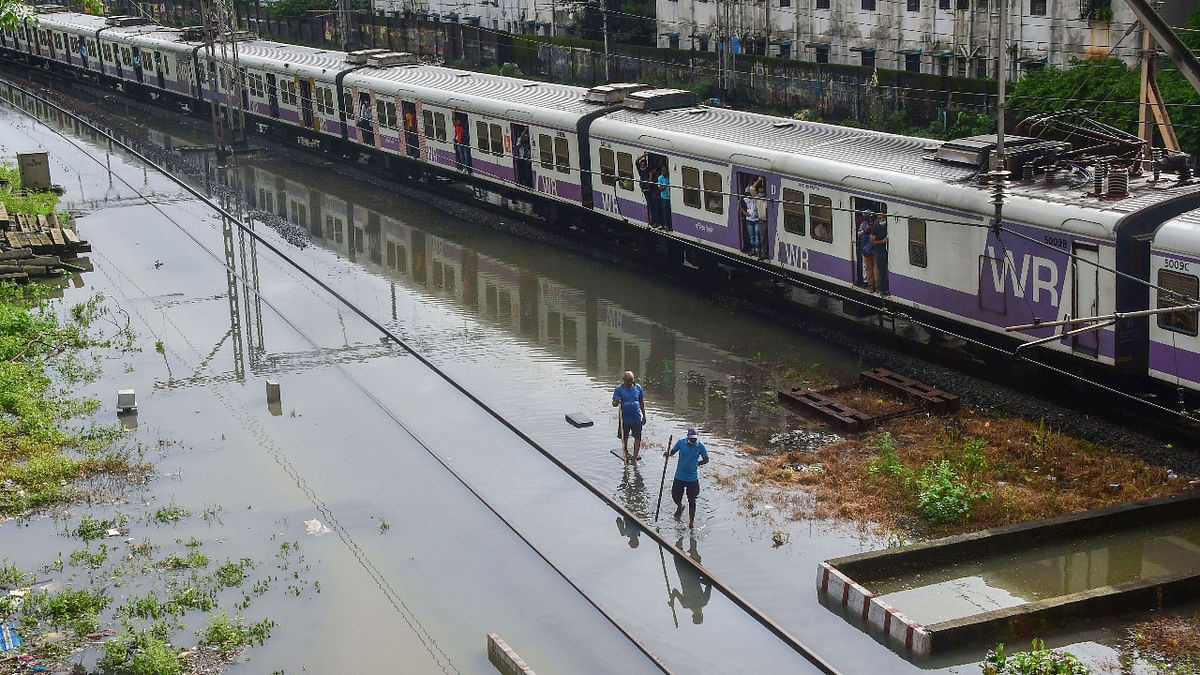 Waterlogging on a railway track due to heavy rain at Matunga area, in Mumbai, Sunday, July 18, 2021. Credit: PTI Photo
