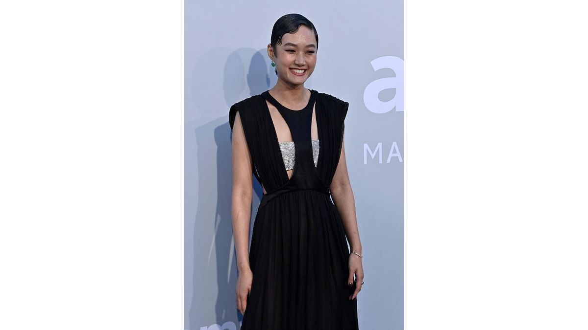 Ash Foo is all smiles in a black long gown. Credit: AFP Photo