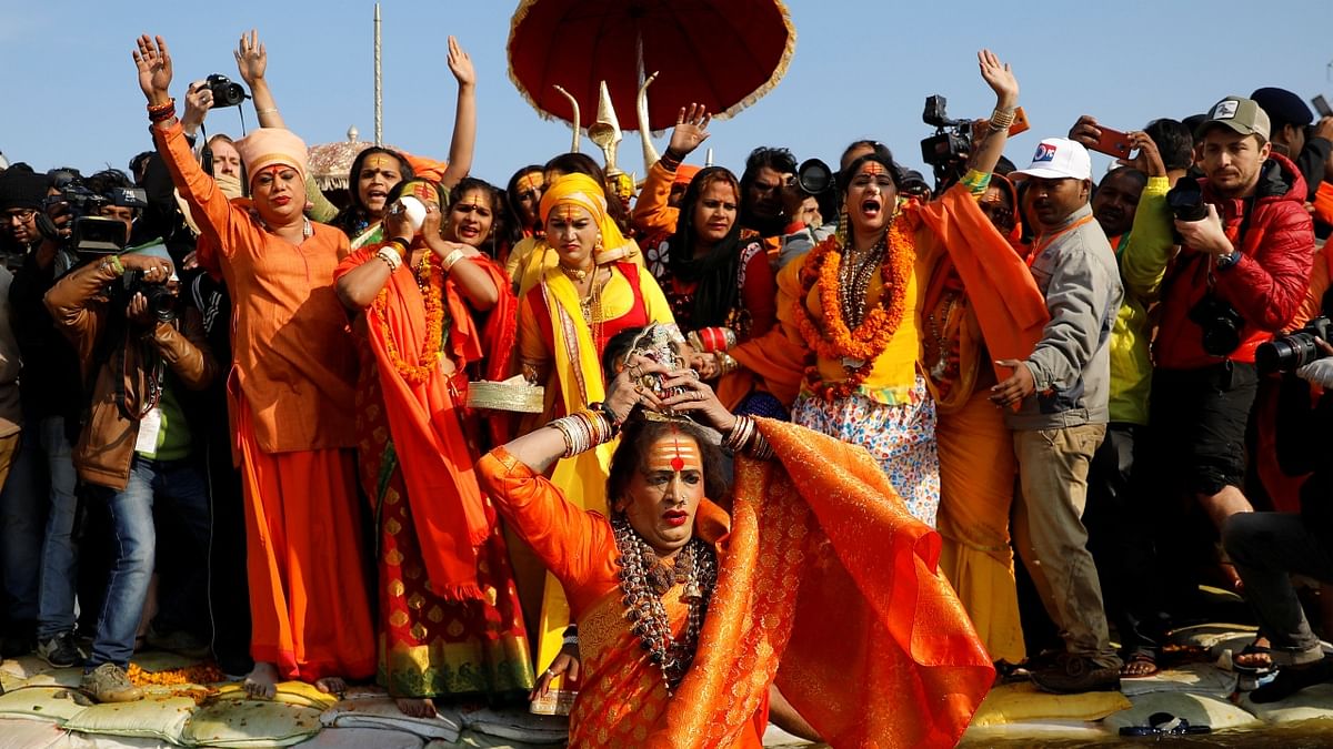 Lakshmi Narayan Tripathi, chief of the 'Kinnar Akhada' takes a dip during the first Shahi Snan during the Kumbh. Credit: Reuters/ Danish Siddiqui