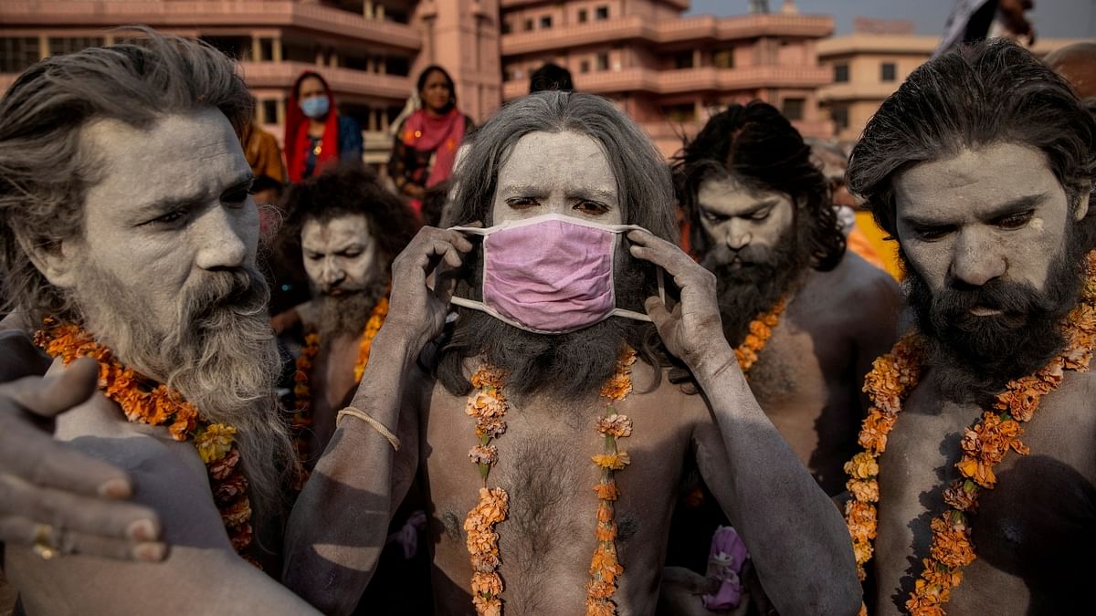 Naga Sadhus are clicked before the procession for taking a dip in the Ganges river during Shahi Snan at Kumbh Mela. Credit: Reuters/ Danish Siddiqui