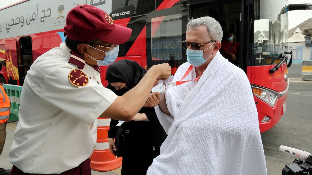 An official checks the ID and permits of pilgrims as they arrive in the Mina area for the annual Hajj pilgrimage, in Mecca. Credit: Reuters Photo