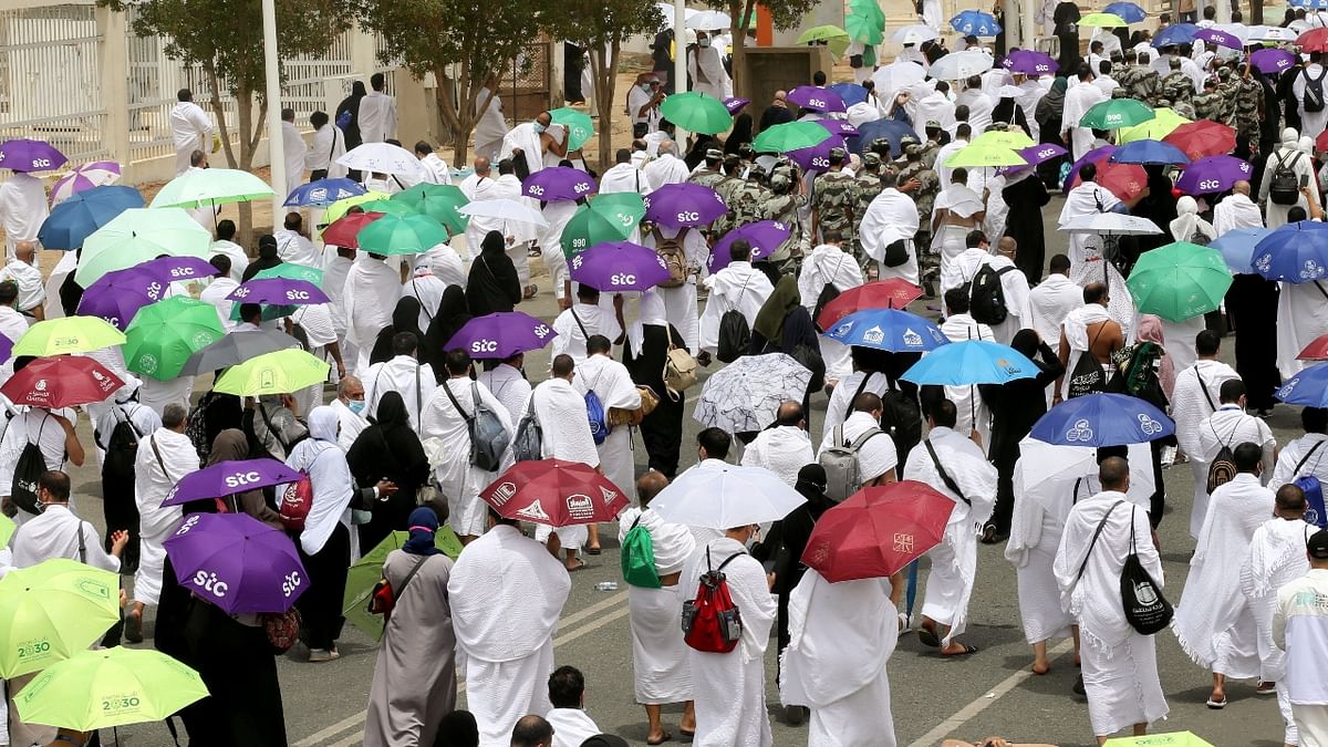 Clad in white and carrying umbrellas against the blistering summer sun, 60,000 Saudi citizens and residents are performing the rite, a once-in-a-lifetime duty for every able-bodied Muslim who can afford it, compared with some 2.5 million in 2019. Credit: Reuters Photo
