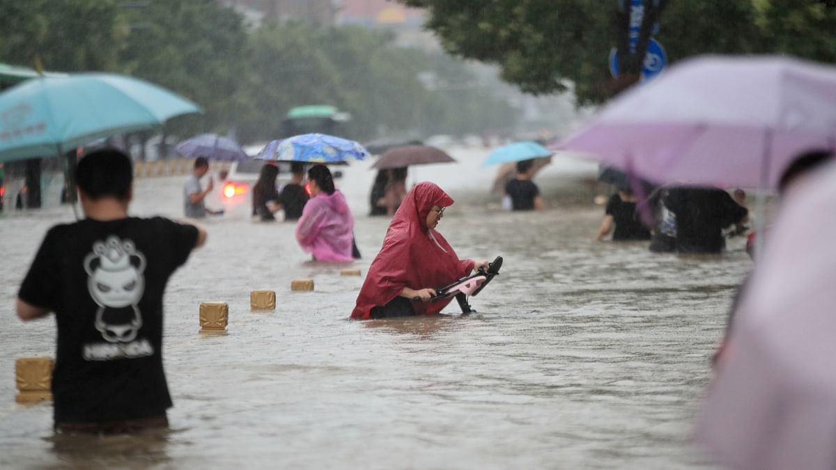 The massive floods, described by meteorologists as a once-in-a-lifetime event, has resulted in apocalyptic scenes in the provincial capital Zhengzhou, a metropolis of 12.6 million, with its public avenues and subway tunnels getting submerged with surging waters. Credit: AFP Photo
