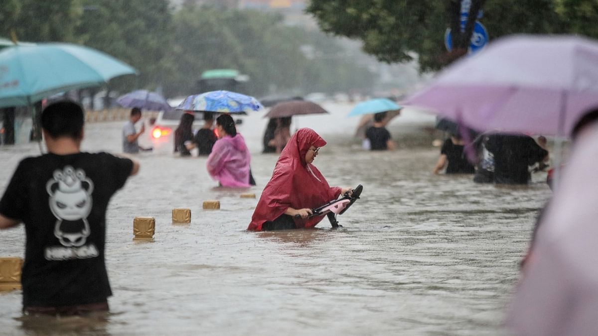 Floodwaters on a road amid heavy rainfall in Zhengzhou, Henan province, China. Credit: Reuters Photo