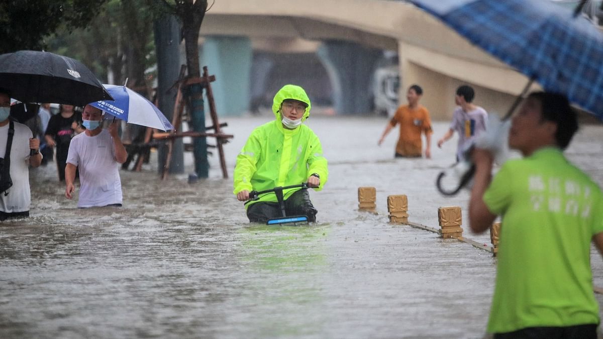 Flood waters along a street following heavy rains in Zhengzhou. Credit: AFP Photo