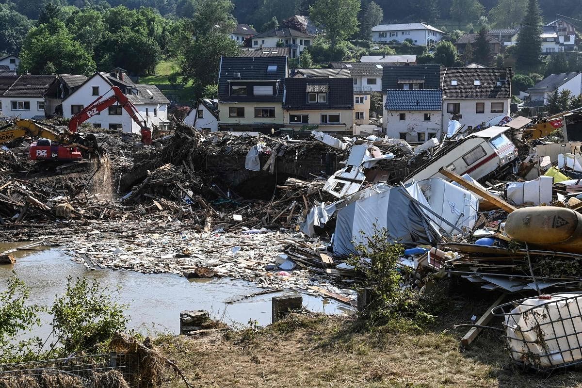 Demolished campers, trash and debris is pictured in Kreuzberg, Rhineland-Palatinate, western Germany, after devastating floods hit the region. Credit: AFP Photo