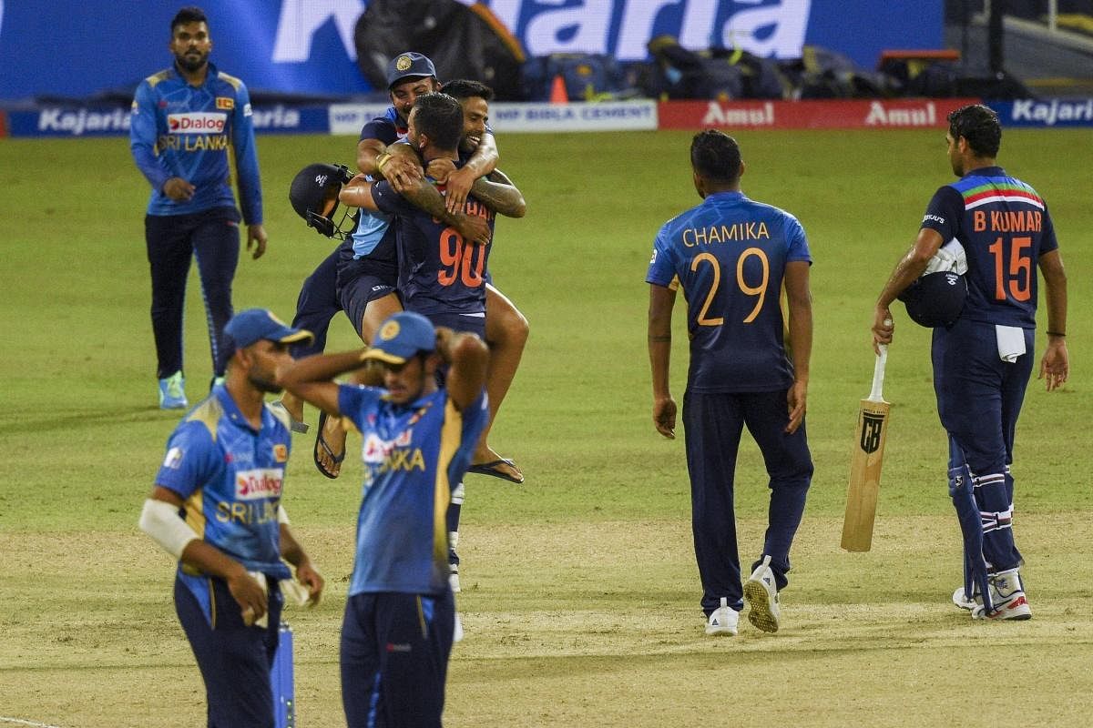 India's Deepak Chahar (C) celebrates with his teammates after India defeated Sri Lanka by 3 wickets in their second one-day international (ODI) cricket match between Sri Lanka and India at the R.Premadasa Stadium in Colombo. Credit: AFP Photo