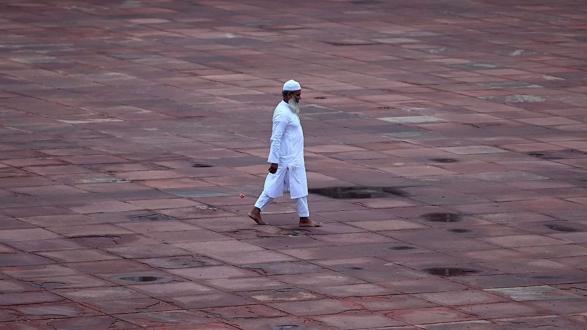A man walks after offering prayers during the Eid al-Adha festival at the Jama Masjid in New Delhi. Credit: AFP Photo