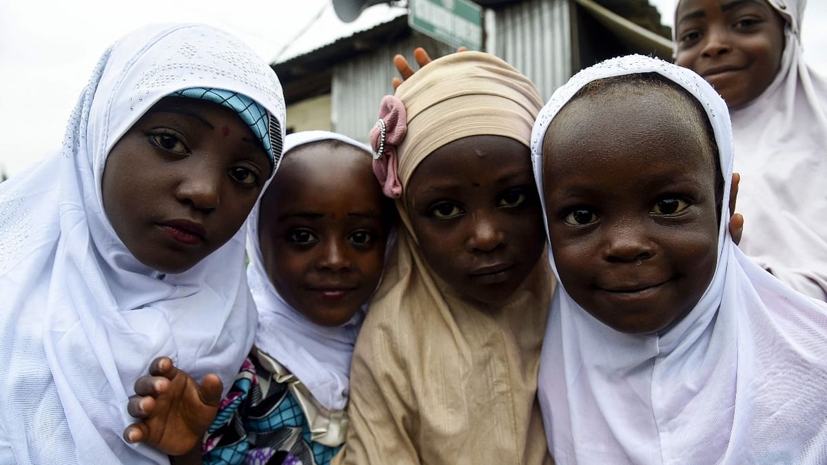 Muslim girls pose for a picture at the Mosque during the Eid-el-adha celebrations at Ibafo Mosque in Ogun State, southwest Nigeria. Credit: AFP Photo