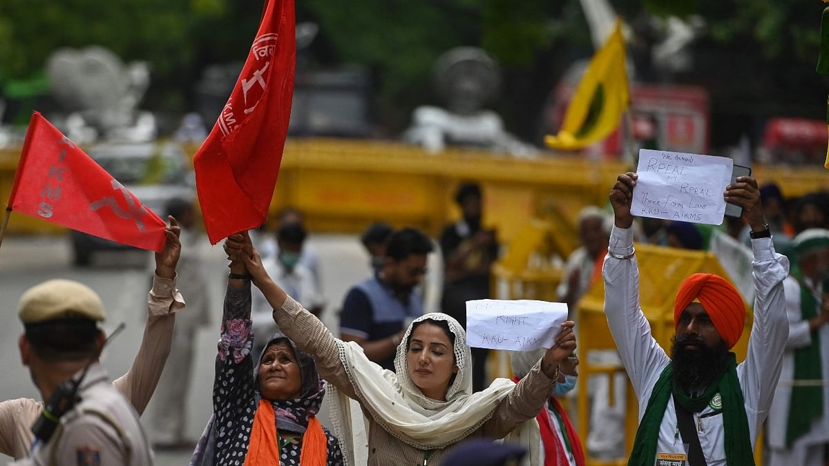 Sonia Mann holds placards and shout slogans as she participates in the protest. Credit: AFP Photo
