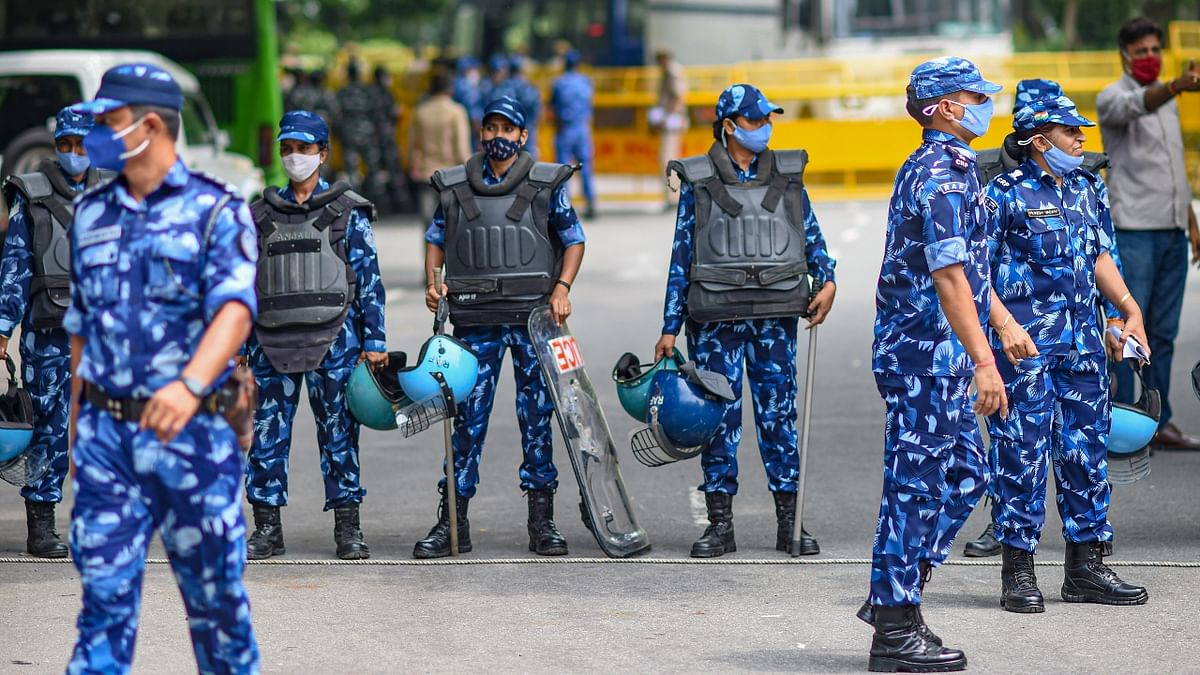 Rapid Action Force, an specialized unit of the Central Reserve Police Force, stood guard at the site, carrying riot shields and batons. Credit: PTI Photo