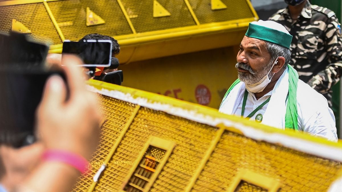 Bharatiya Kisan Union (BKU) leader Rakesh Tikait speaks with media representatives as farmers protest against the central government’s agricultural reforms, in New Delhi. Credit: AFP Photo