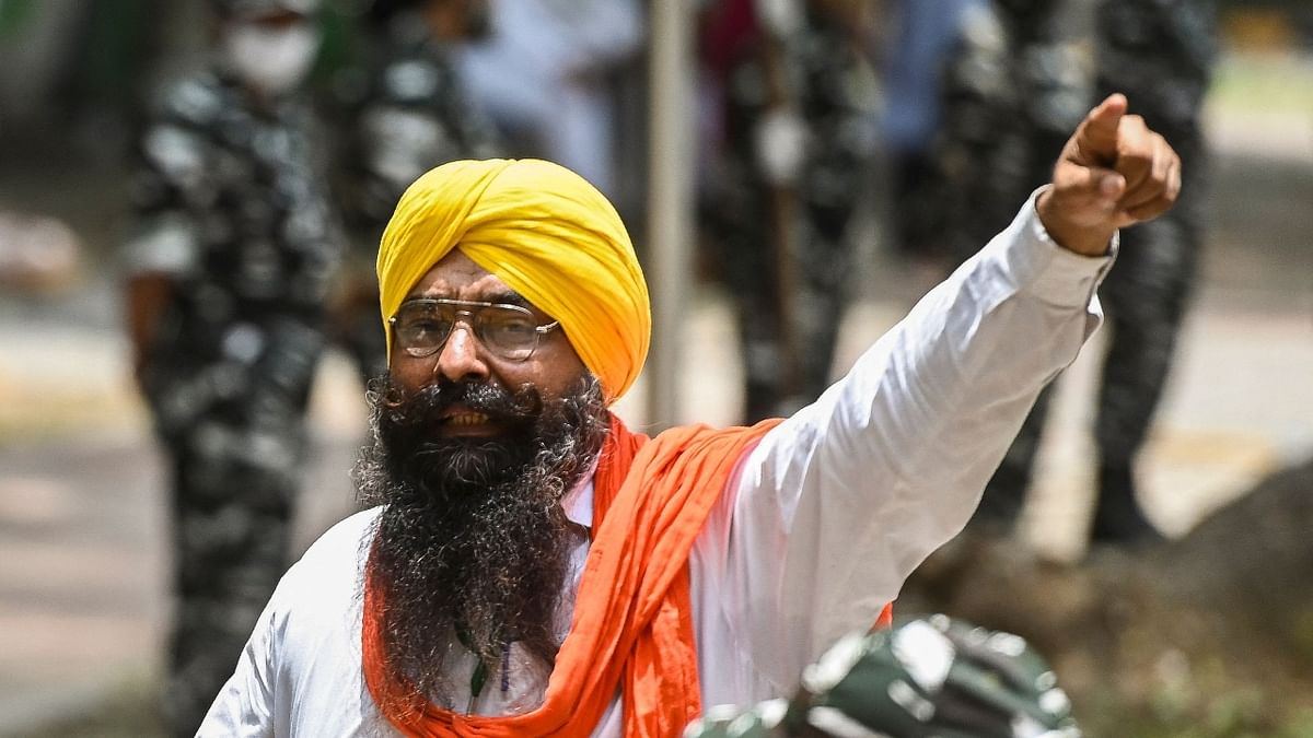 A farmer is seen shouting slogans at the protest site. Credit: AFP Photo