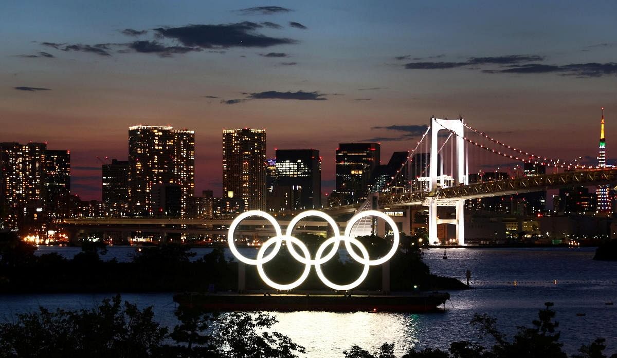 The Olympic Rings are seen in front of the skyline during sunset ahead of the official opening of the Tokyo 2020 Olympic Games in Tokyo, Japan. Credit: Reuters Photo