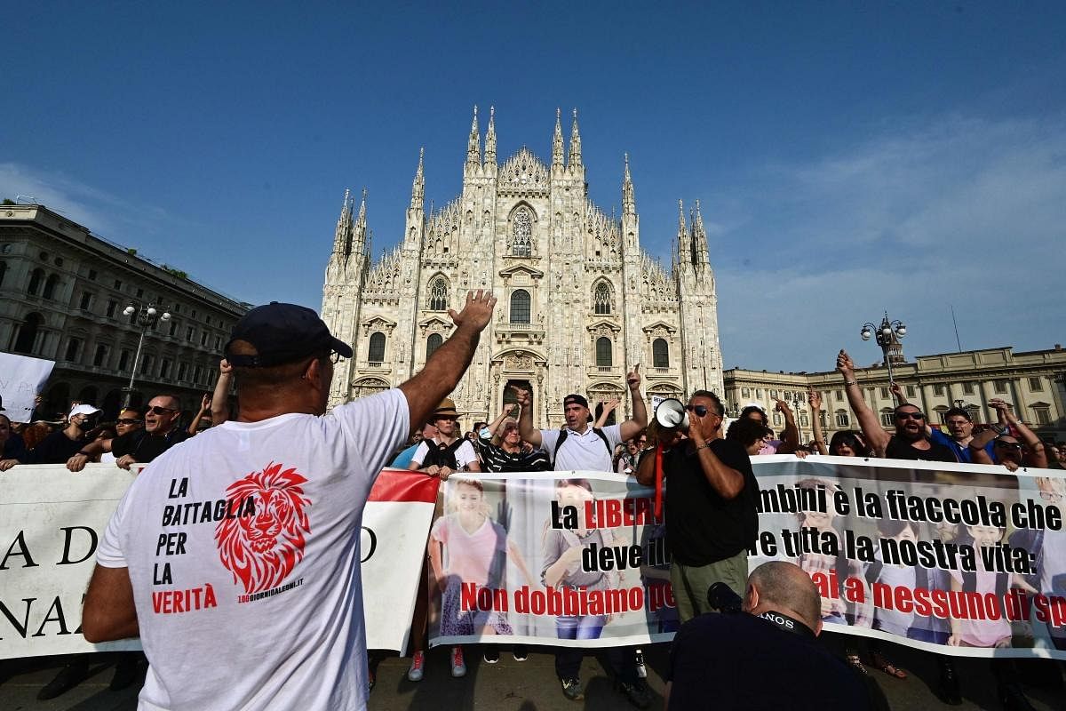 Protesters take part in a demonstration on Piazza Duomo in Milan on July 24, 2021, against the introduction of a mandatory 'green pass' for indoor dining and entertainment area, in the aim to limit the spread of the Covid-19. Credit: AFP Photo