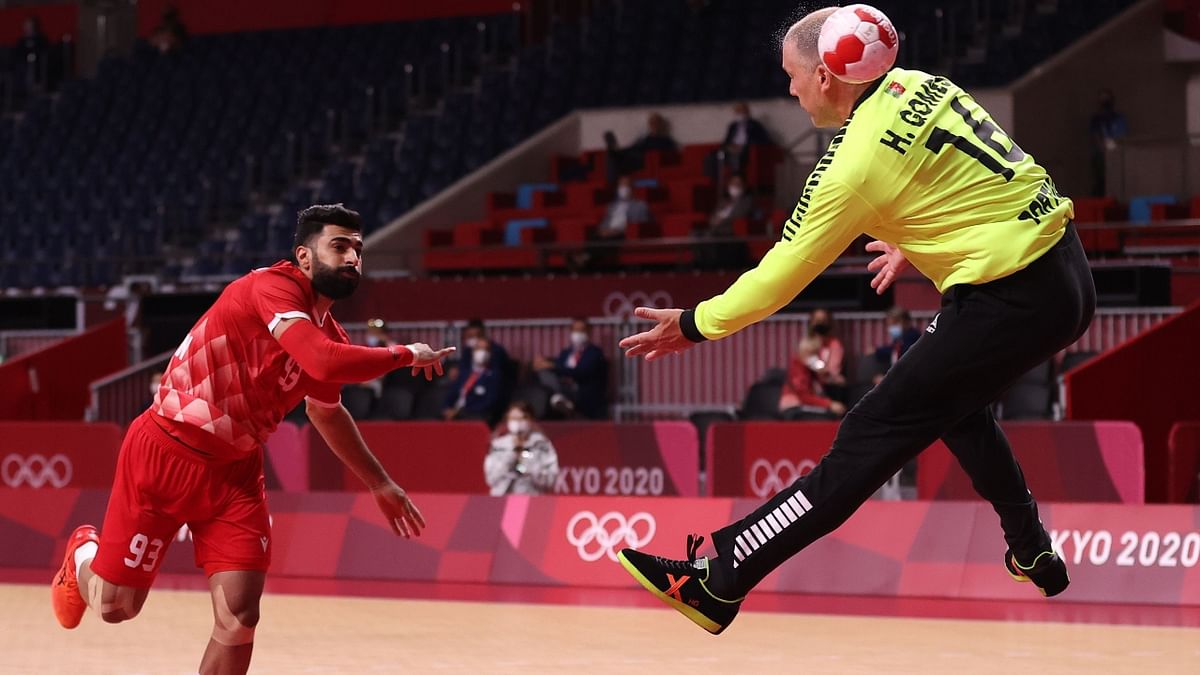 Mohamed Ahmed of Bahrain in action with Humberto Gomes of Portugal. Credit: Reuters Photo