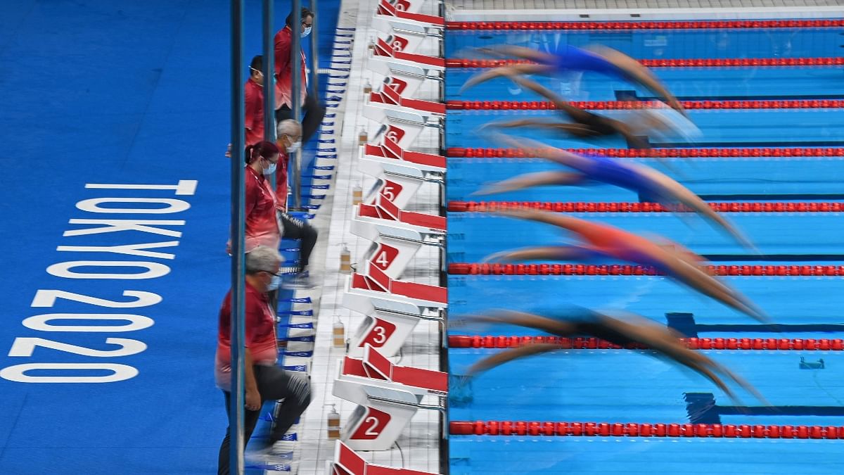 Swimmers take the start of a heat for the women's 200m freestyle swimming event. Credit: AFP Photo