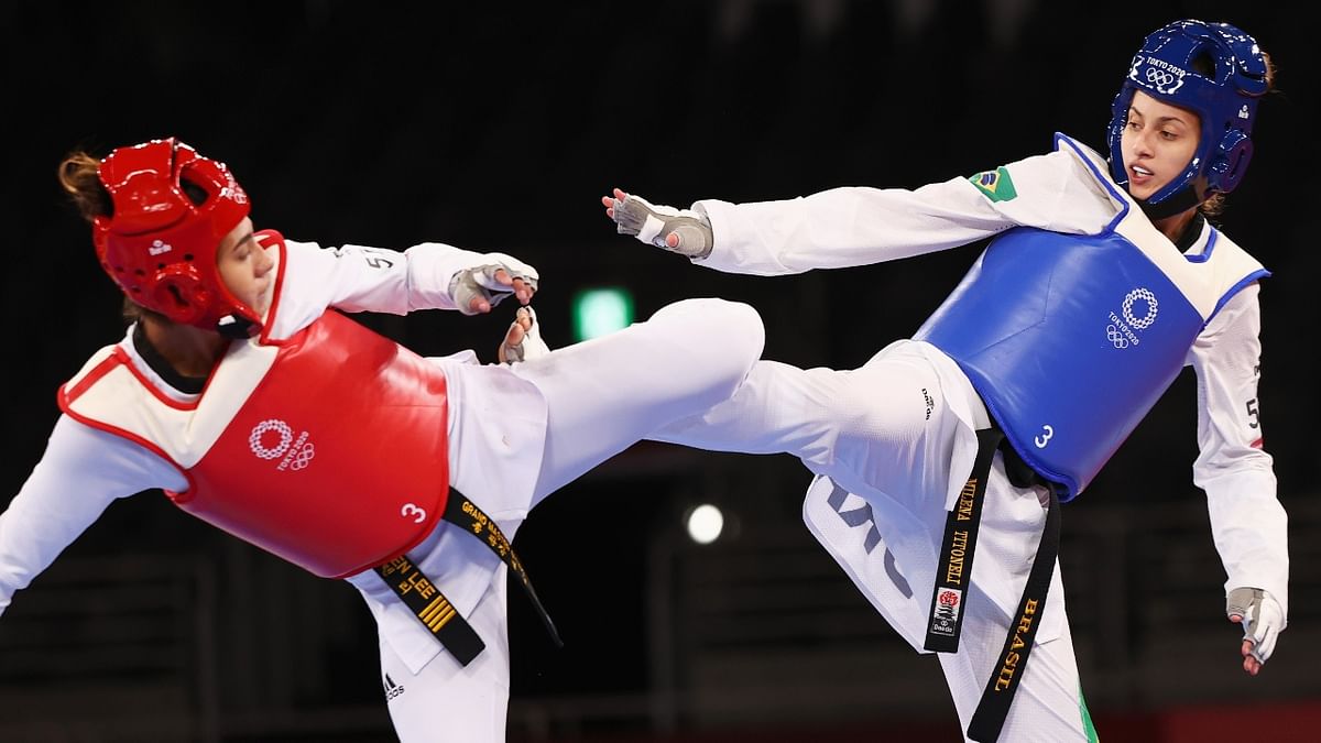 Milena Titoneli Guimaraes of Brazil in action against Lauren Anna Lee of Haiti. Credit: Reuters Photo