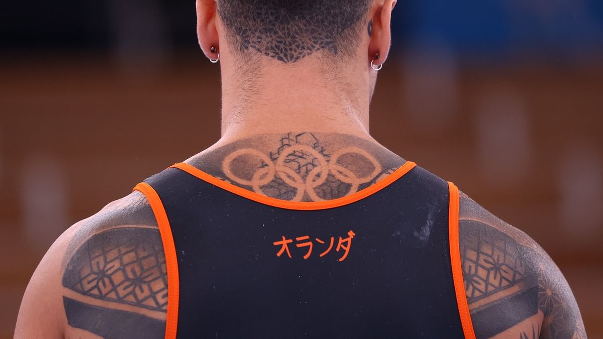 A tattoo of the Olympic rings are seen on the back of a Netherlands athlete. Credit: Reuters Photo