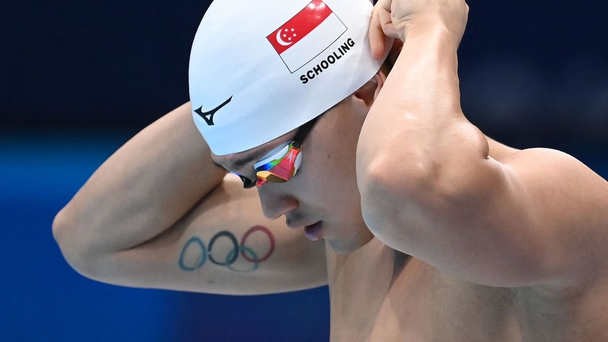 Singapore's Joseph Schooling has inked the Olympic Rings tattoo on the arm. Credit: AFP Photo
