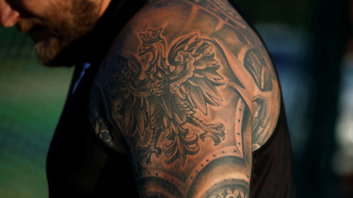 Poland's hammer thrower Pawel Fajdek's tattoo, with the Polish emblem on his arm. Credit: Reuters Photo