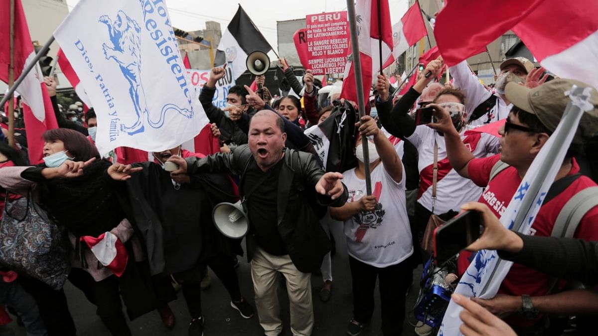 People shout slogans during a protest against Peru's President Pedro Castillo on the Inauguration Day in Lima, Peru. Credit: Reuters photo