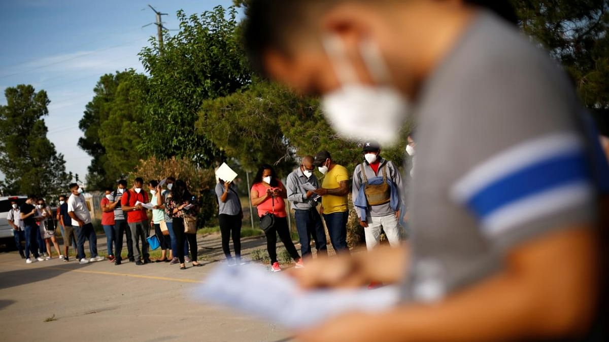 Mexican citizens queue to be transferred to the US via the international border bridge of Tornillo-Guadalupe to receive a dose of the Johnson & Johnson Covid-19 vaccine, during a binational vaccination program, in Ciudad Juarez. Credit: Reuters photo