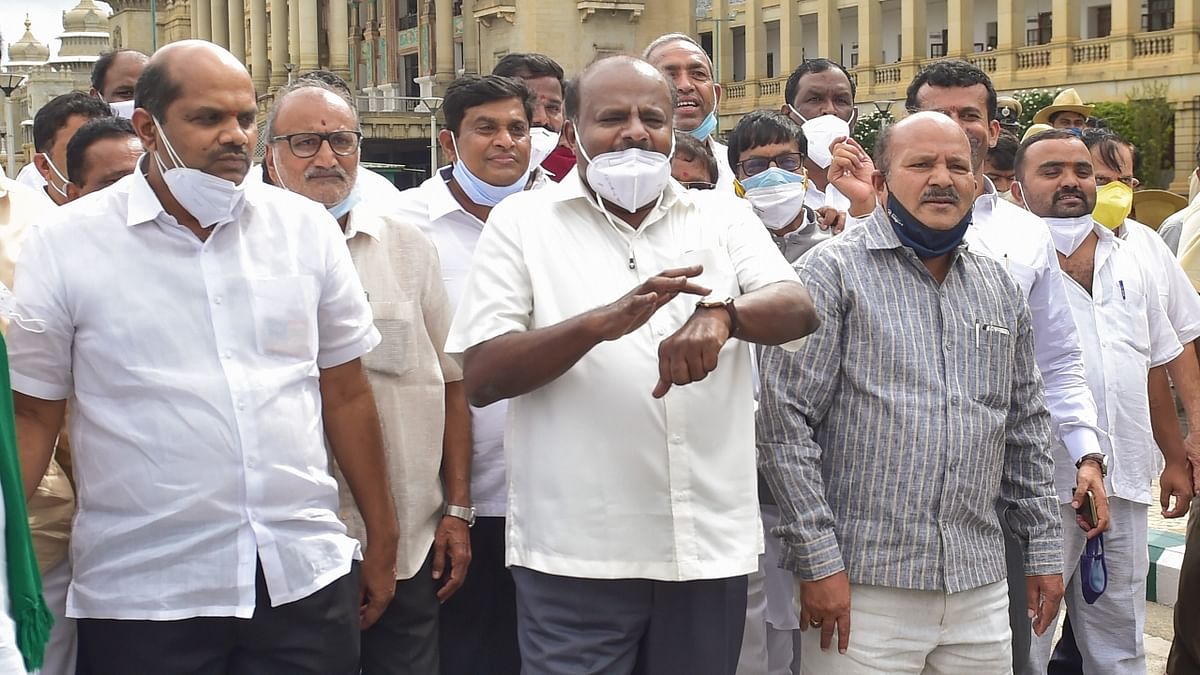 Kumaraswamy with party MLAs during a protest rally at Raj Bhavan in Bengaluru. Credit: PTI Photo