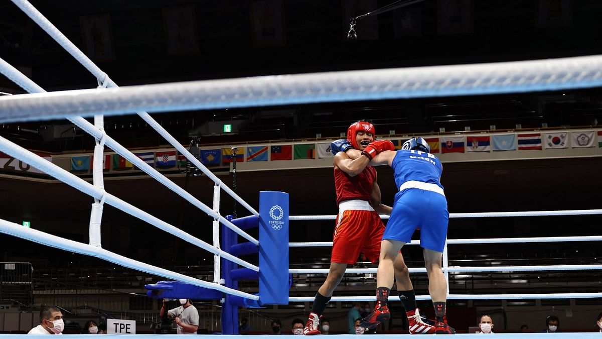 Lovlina Borgohain and Nien-Chin Chen fight during their women's welter (64-69kg) quarter-final boxing match. Credit: AFP Photo