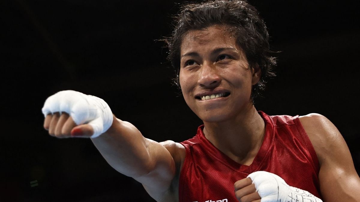 Lovlina Borgohain celebrates after winning against Nien-Chin Chen after their quarter-final boxing match. Credit: AFP Photo
