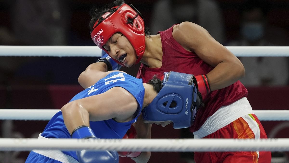 Lovlina Borgohain exchanges punches with Chen Nien-Chin during women's welterweight (64-69kg) category boxing match. Credit: PTI Photo