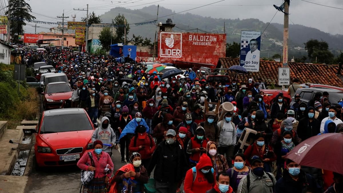 Mayan indigenous people leave a road blockade after a protest to demand the resignation of Guatemalan President Alejandro Giammattei and Attorney General Maria Porras, in San Cristobal Totonicapan, Guatemala. Credit: Reuters photo