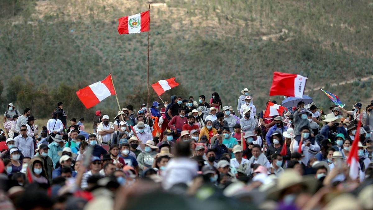 Supporters of the Peruvian President Pedro Castillo arrive at the Pampa de la Quinua to attend the symbolic presidential investiture ceremony in Ayacucho, southern Peru, on July 29, 2021. Credit: AFP Photo / Peruvian Presidency / Alberto Orbegoso