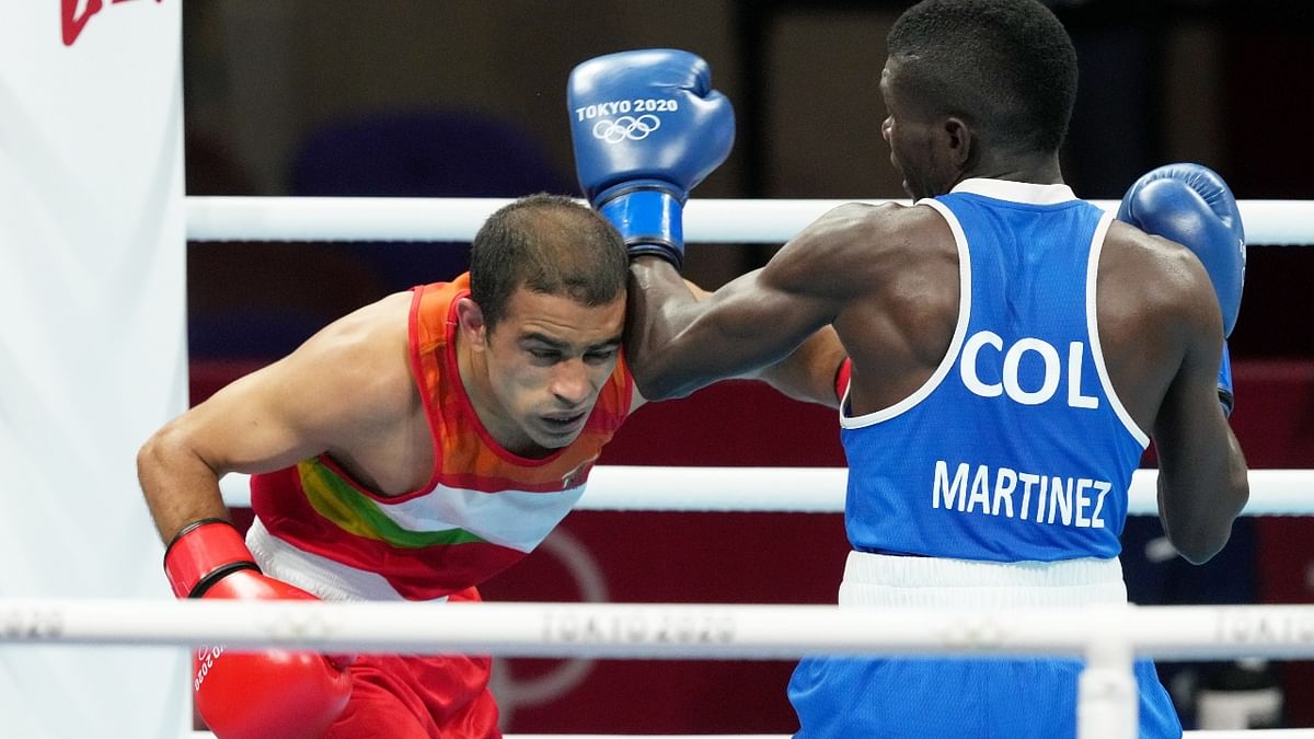 World number one boxer Amit Panghal was knocked out of Tokyo Olympics after losing to Colombia’s Yuberjen Martinez in his first bout in the men's 52kg (flyweight) category. Panghal lost a round of 16 by a 1:4 split verdict. Credit: PTI Photo