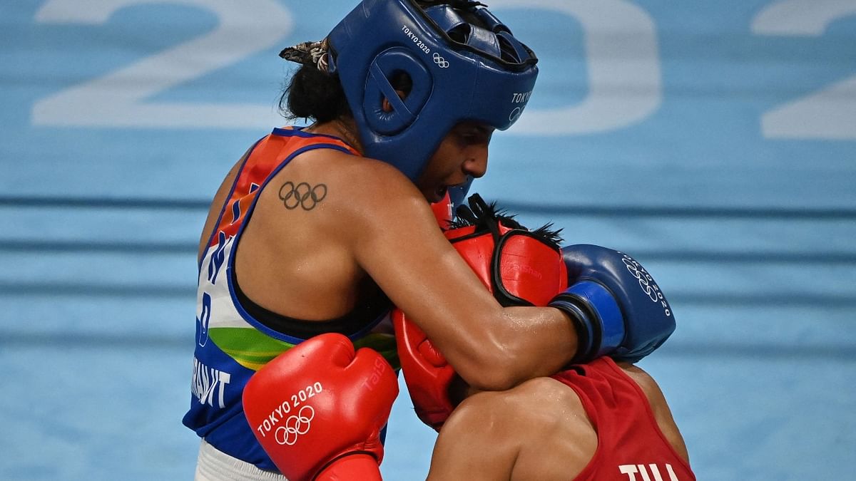 Simranjit Kaur and Sudaporn Seesondee fight during their women's light weight (57-60 kg) preliminaries round of 16 boxing match during the Tokyo 2020 Olympic Games at the Kokugikan Arena in Tokyo. Credit: AFP Photo