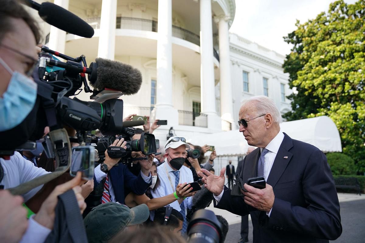 US President Joe Biden speaks to reporters before boarding Marine One on the South Lawn of the White House in Washington DC on July 30, 2021. Credit: AFP Photo