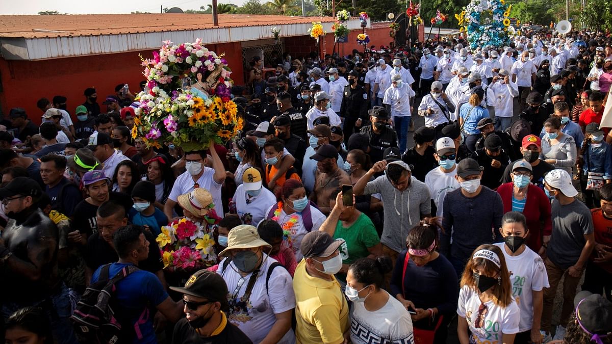 Devotees participate in a procession as a part of festivities of the patron saint of Managua Santo Domingo de Guzman in Managua. Credit: Reuters Photo