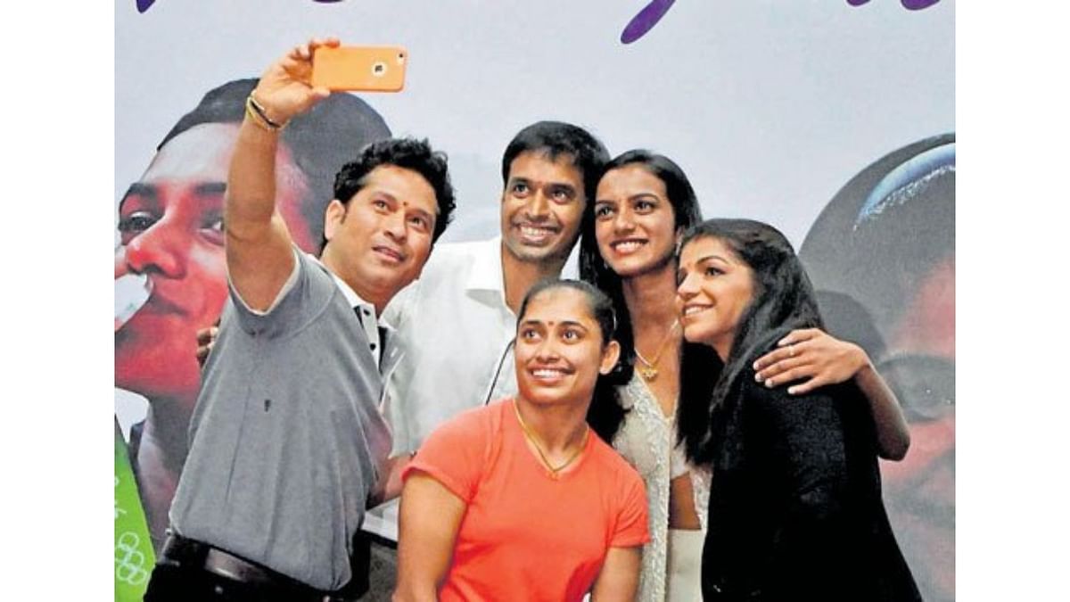 Heaping high praise on PV Sindhu and Sakshi Malik for winning medals at the Rio Games, cricket icon Sachin Tendulkar presented them with BMW cars. Coach Gopichand was also gifted one. Credit: PTI Photo