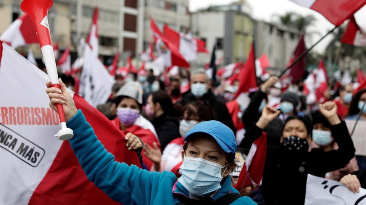 People participate in a protest against communism and Peru's new government led by President Pedro Castillo, a self-described Marxist-Leninist, in Lima. Credit: Reuters Photo