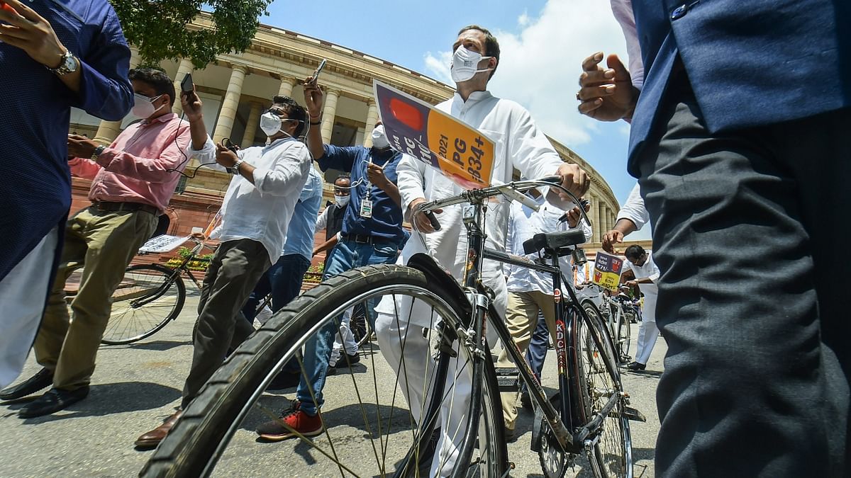 Congress leader Rahul Gandhi came in a bicycle to the Parliament on August 3 to protest against the fuel prices, particularly petrol, which has crossed the Rs 100 per litre-mark in various parts of the country. Credit: PTI Photo